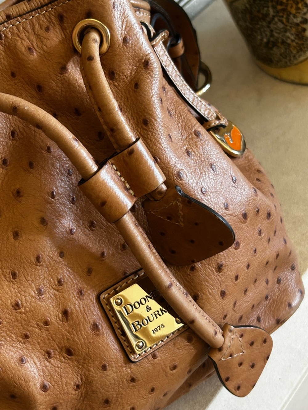 Dooney & Bourke Tan Ostrich-Embossed Drawstring Bucket Bag - Picture 14 of 17